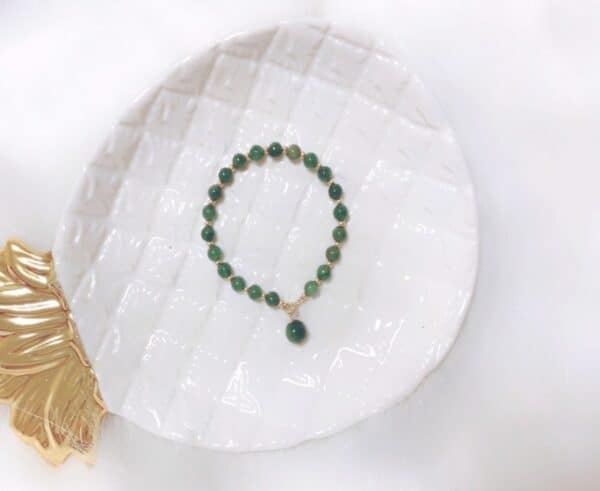 Handmade in dark oil green jade 14k bag gold small gold beads white bracelet goddess